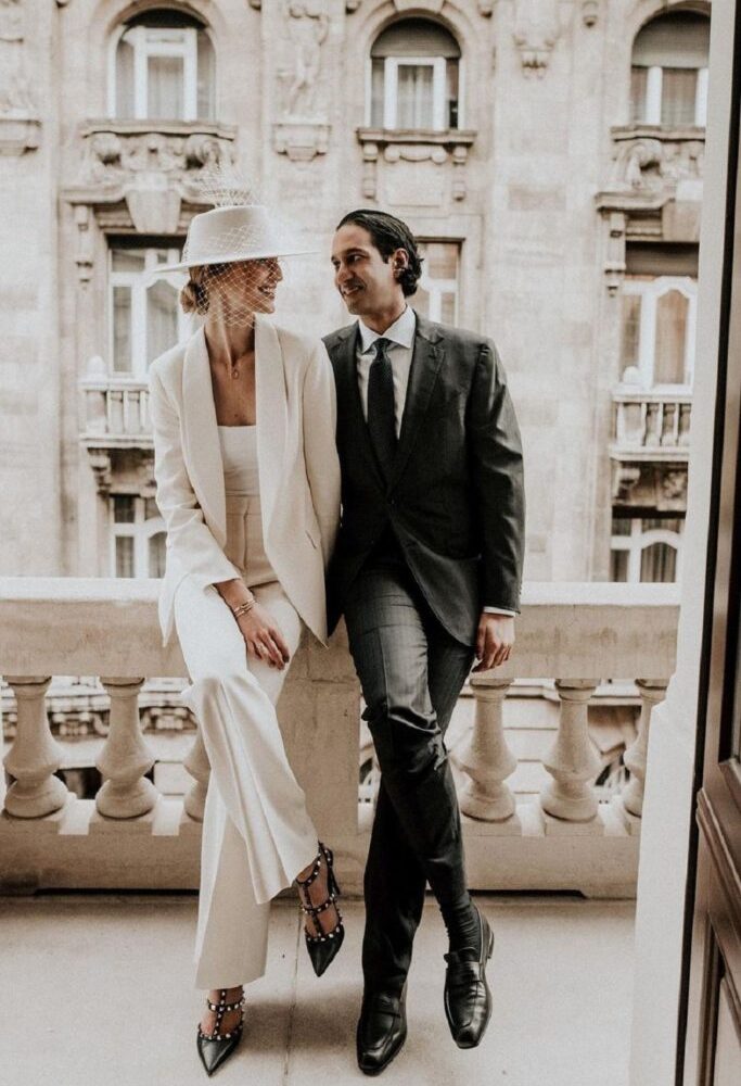 Wedding style trends with bride and groom sitting on the balcony